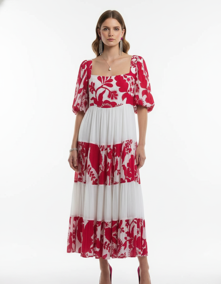 Woman wearing a red and white floral dress on a white background